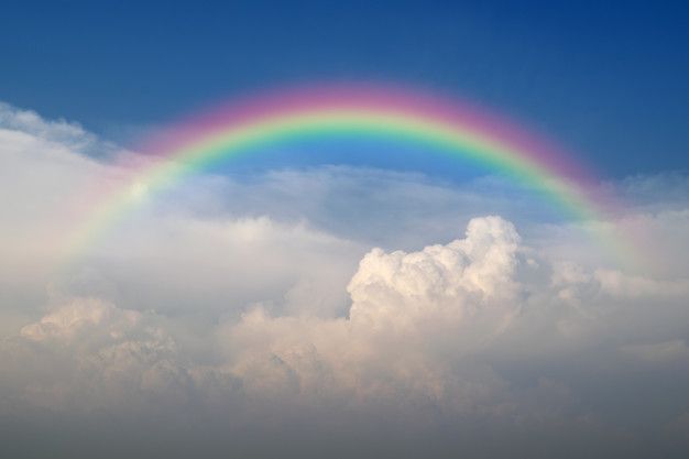 cloudscape-with-blue-sky-white-clouds-rainbow_41043-1840.jpg