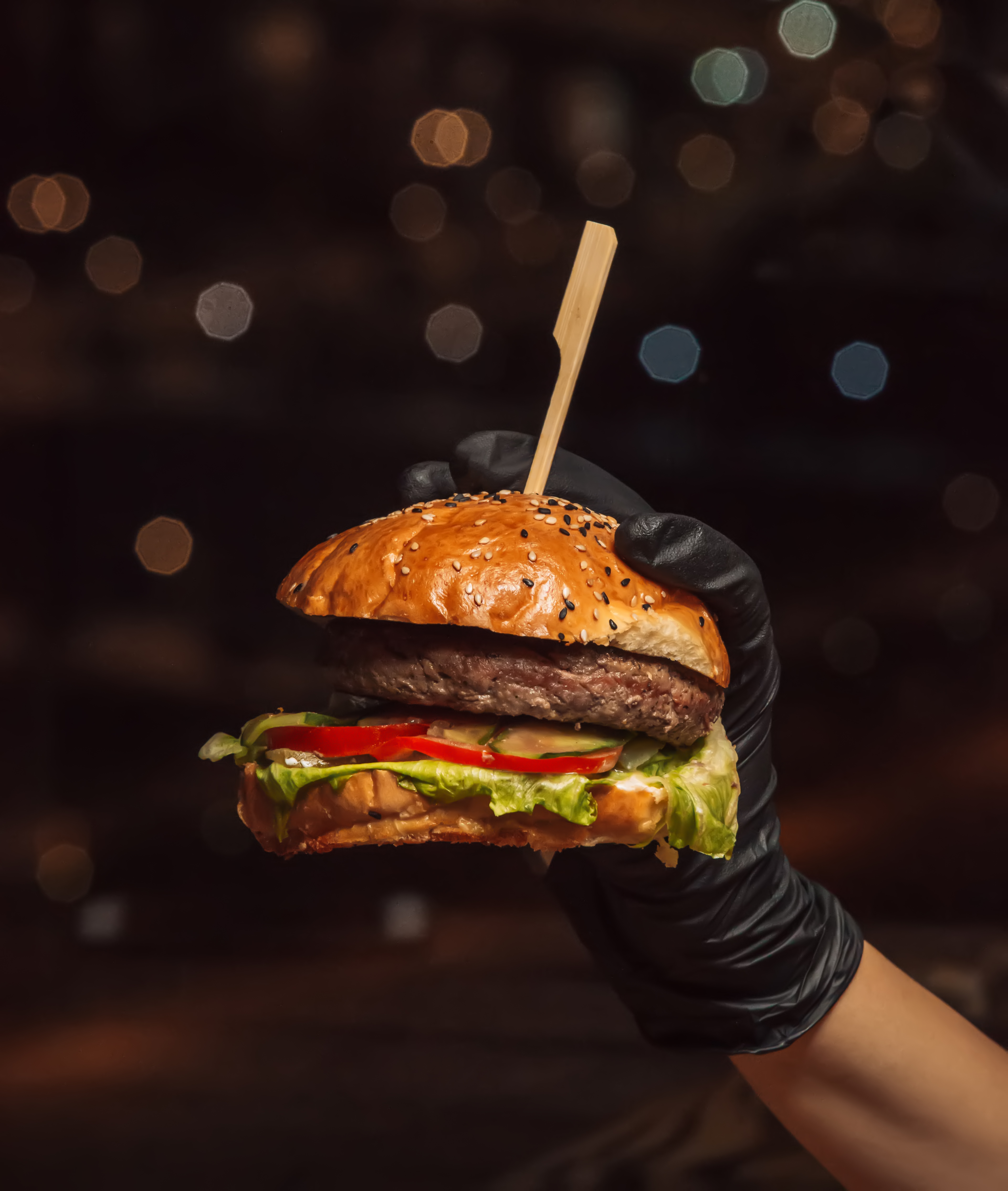 hand-burger-gloves-holding-beef-burger-black-background.jpg